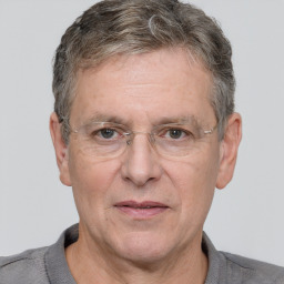 Joyful white middle-aged male with short  brown hair and brown eyes