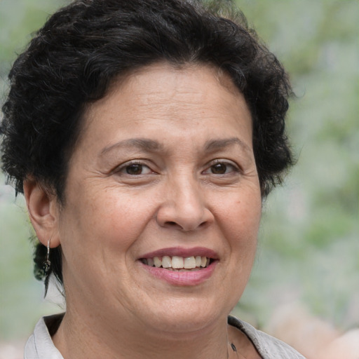 Joyful white adult female with short  brown hair and brown eyes