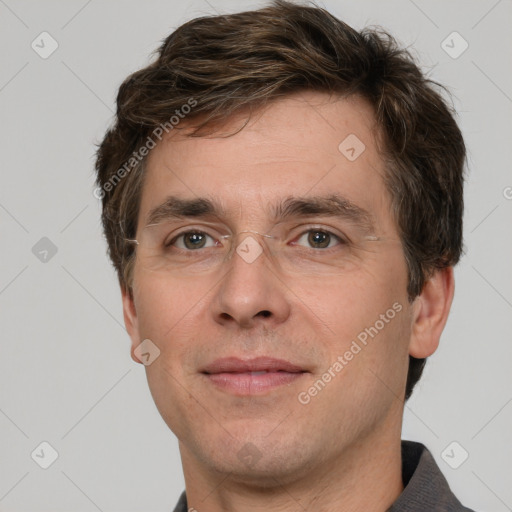 Joyful white adult male with short  brown hair and grey eyes