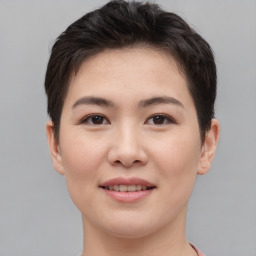 Joyful asian young-adult female with short  brown hair and brown eyes