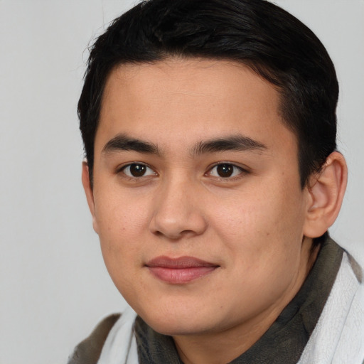 Joyful asian young-adult male with short  brown hair and brown eyes