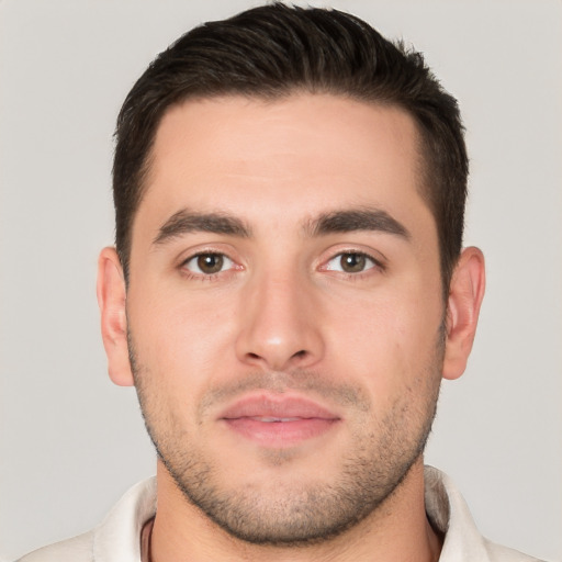 Joyful white young-adult male with short  brown hair and brown eyes