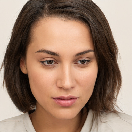 Neutral white young-adult female with medium  brown hair and brown eyes