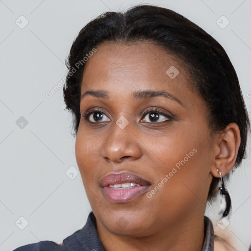 Joyful black young-adult female with medium  black hair and brown eyes