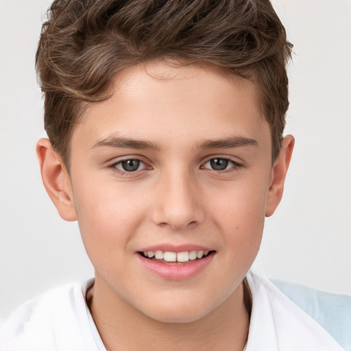 Joyful white child male with short  brown hair and brown eyes