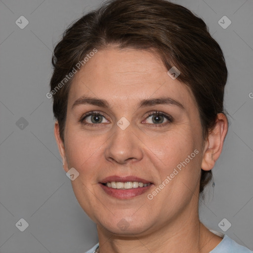 Joyful white adult female with short  brown hair and brown eyes