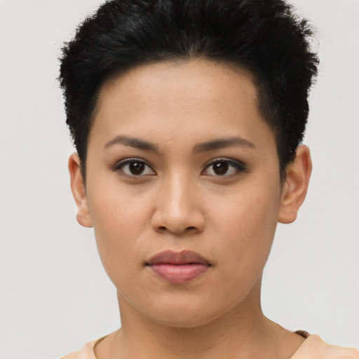 Joyful asian young-adult female with short  brown hair and brown eyes