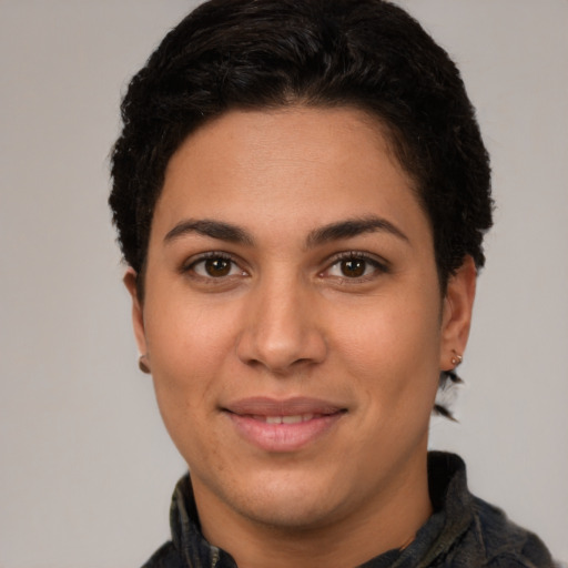 Joyful latino young-adult female with short  brown hair and brown eyes