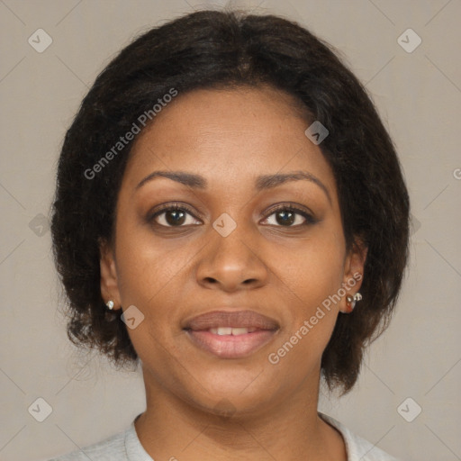 Joyful black young-adult female with medium  brown hair and brown eyes