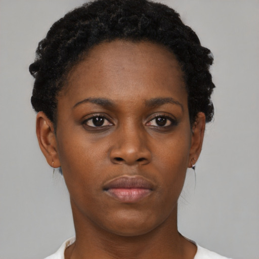 Neutral black young-adult female with short  black hair and brown eyes