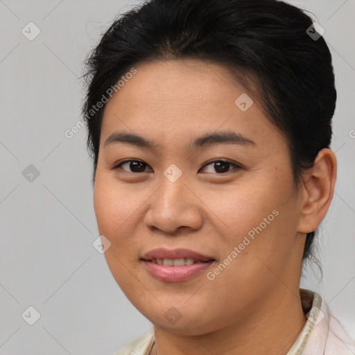 Joyful asian young-adult female with short  brown hair and brown eyes