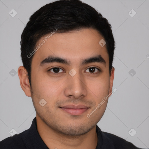 Joyful latino young-adult male with short  black hair and brown eyes