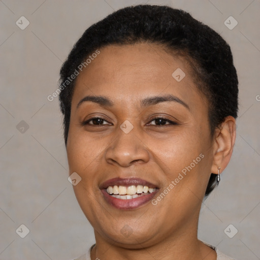 Joyful latino adult female with short  brown hair and brown eyes