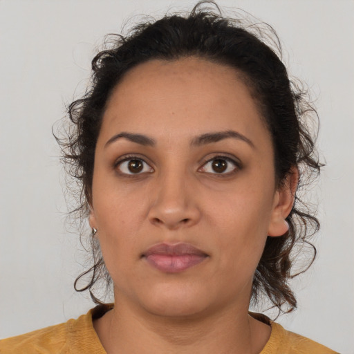 Neutral latino young-adult female with medium  brown hair and brown eyes