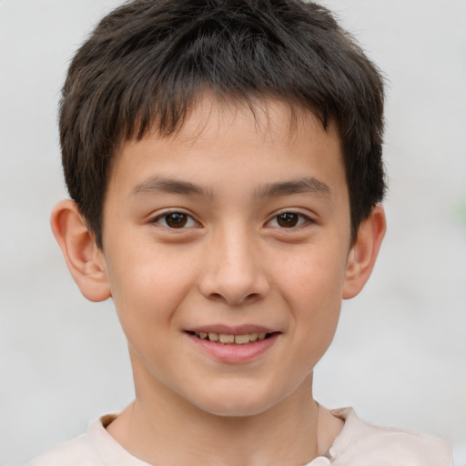 Joyful white child male with short  brown hair and brown eyes