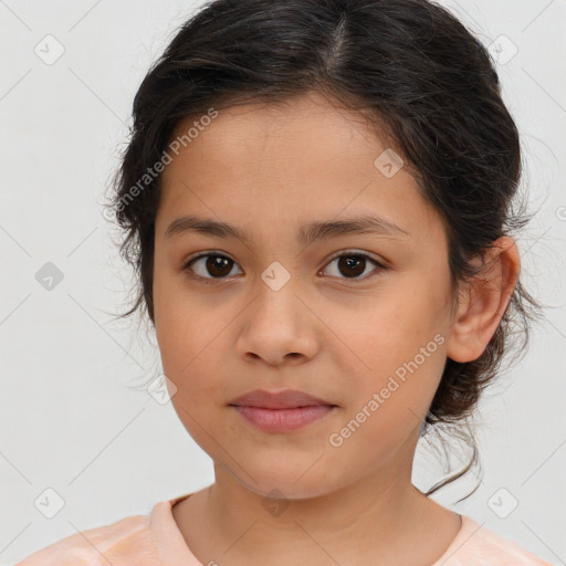 Joyful white child female with medium  brown hair and brown eyes