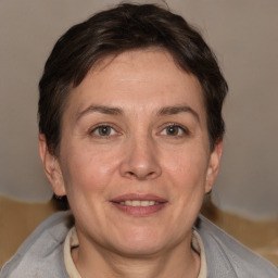 Joyful white adult female with short  brown hair and brown eyes