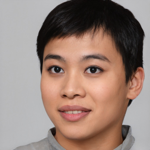 Joyful asian young-adult male with short  black hair and brown eyes
