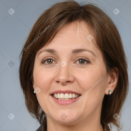 Joyful white adult female with medium  brown hair and grey eyes