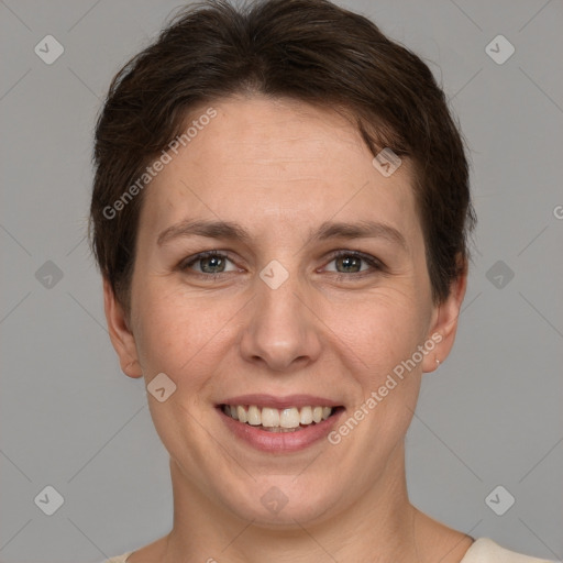 Joyful white young-adult female with short  brown hair and grey eyes