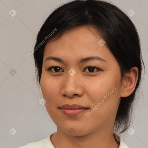 Joyful asian young-adult female with medium  brown hair and brown eyes