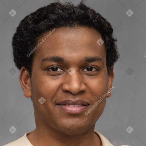 Joyful black young-adult male with short  brown hair and brown eyes