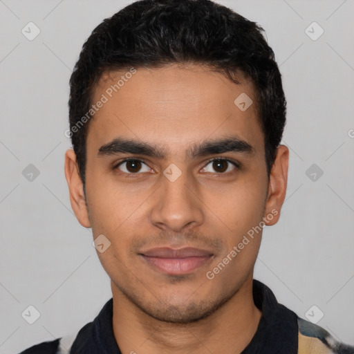 Joyful latino young-adult male with short  black hair and brown eyes