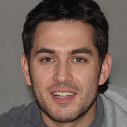 Joyful white adult male with short  brown hair and brown eyes