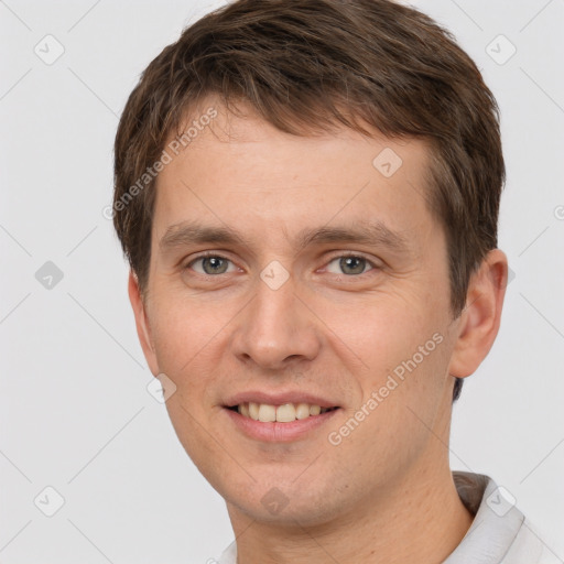 Joyful white young-adult male with short  brown hair and brown eyes