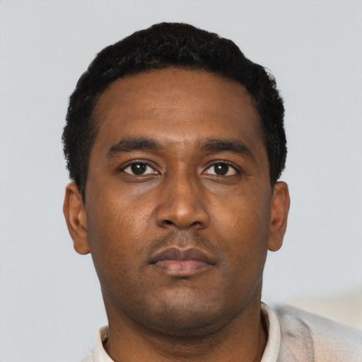 Neutral black young-adult male with short  black hair and brown eyes