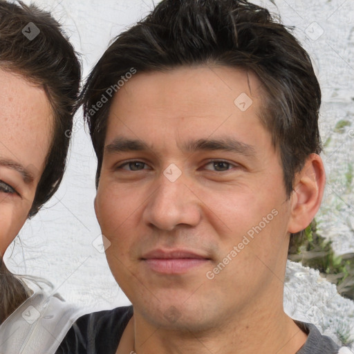 Joyful white young-adult male with medium  brown hair and brown eyes