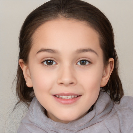 Joyful white child female with medium  brown hair and brown eyes