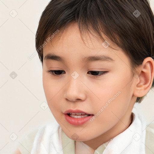 Joyful white child female with short  brown hair and brown eyes