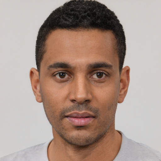 Neutral black young-adult male with short  black hair and brown eyes