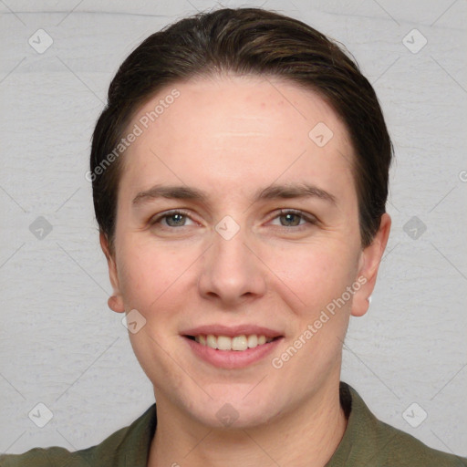 Joyful white young-adult female with short  brown hair and grey eyes