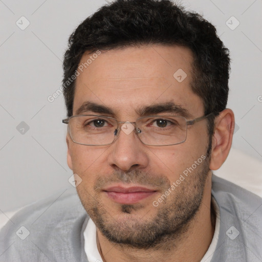 Joyful white adult male with short  brown hair and brown eyes