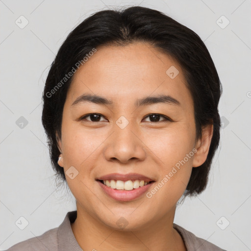 Joyful asian young-adult female with medium  brown hair and brown eyes