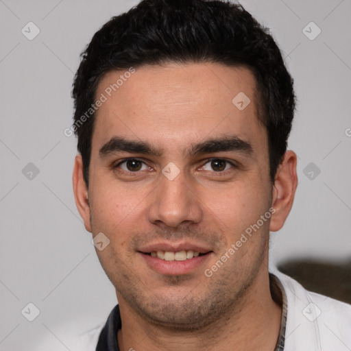 Joyful white young-adult male with short  black hair and brown eyes