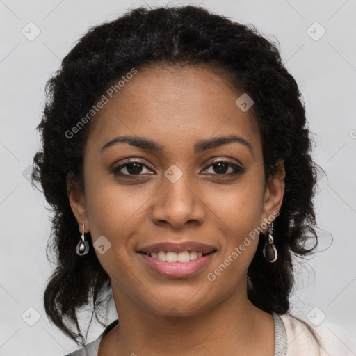 Joyful black young-adult female with long  brown hair and brown eyes