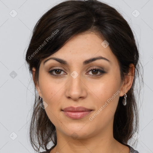 Joyful latino young-adult female with medium  brown hair and brown eyes