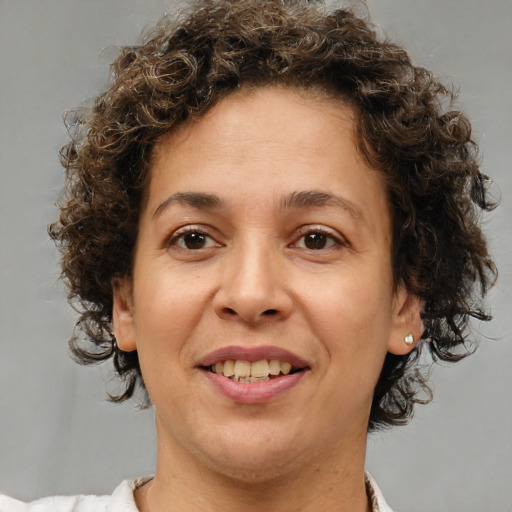 Joyful white adult female with short  brown hair and brown eyes