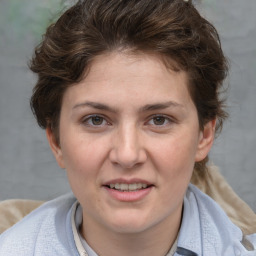 Joyful white adult female with short  brown hair and grey eyes