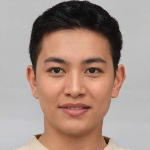 Joyful asian young-adult male with short  brown hair and brown eyes