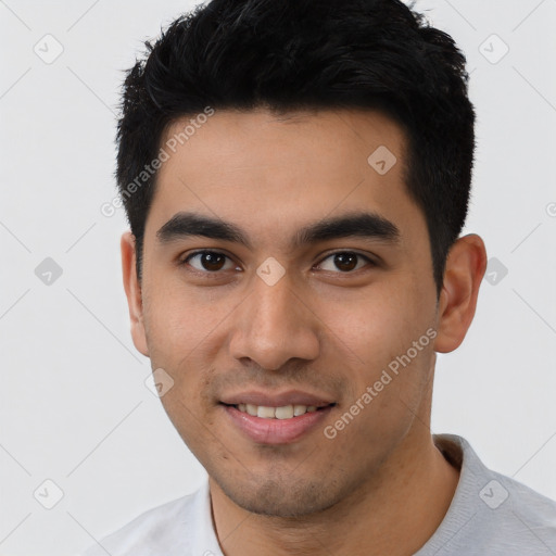 Joyful latino young-adult male with short  black hair and brown eyes