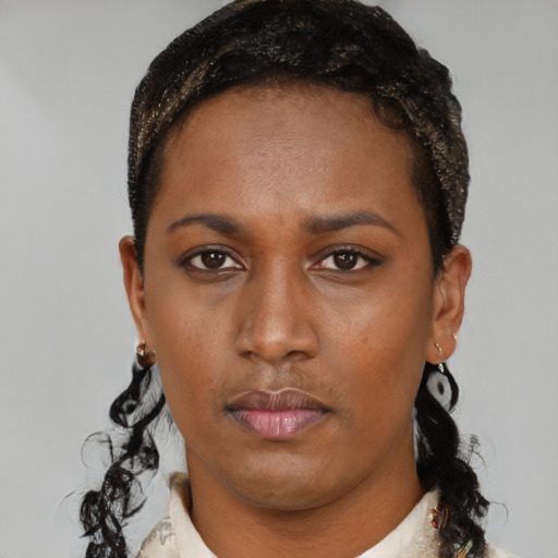Neutral black young-adult female with short  brown hair and brown eyes