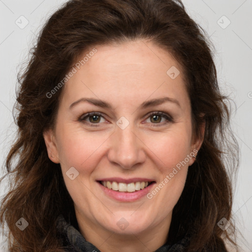 Joyful white adult female with long  brown hair and brown eyes