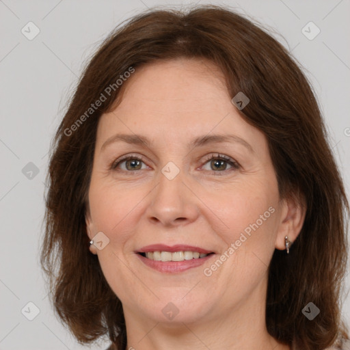 Joyful white adult female with medium  brown hair and grey eyes