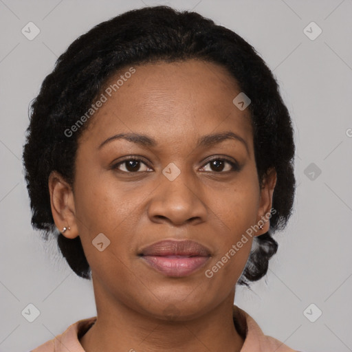 Joyful black adult female with short  brown hair and brown eyes