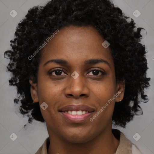 Joyful black young-adult female with long  black hair and brown eyes