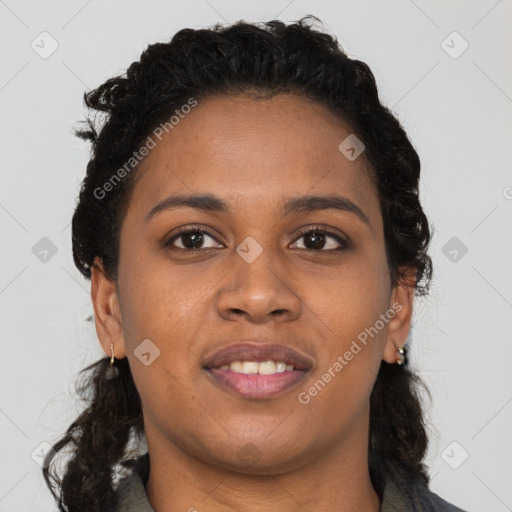 Joyful black young-adult female with long  brown hair and brown eyes